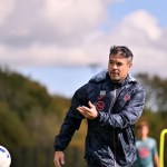 Darren O’Dea overseeing Swansea City training session on the pitch.