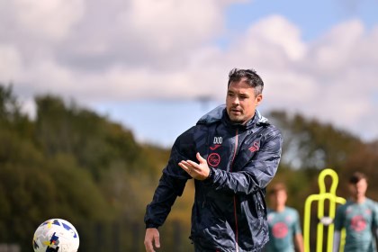 Darren O’Dea overseeing Swansea City training session on the pitch.