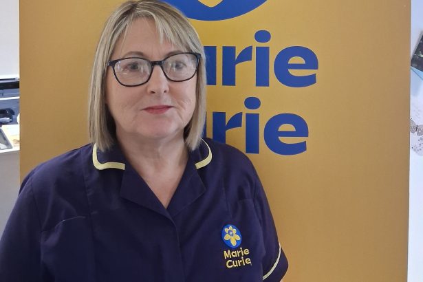 Diane Thomas wearing a Marie Curie uniform, smiling gently, sharing her story about advance care planning.