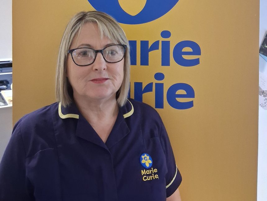 Diane Thomas wearing a Marie Curie uniform, smiling gently, sharing her story about advance care planning.