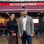 Front of Ruta Kitchen café in Swansea with Charlotte Price, Development Bank of Wales, and co‑founder Vladimir Pavliiciuc.