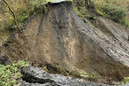 Collapsed section of cycle path near Tumble where a landslide has washed away the route after flooding.