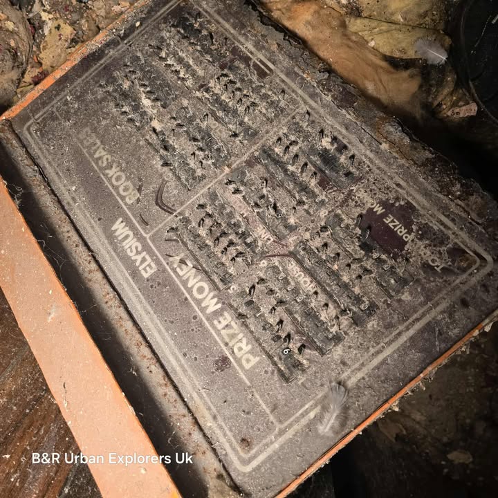 Corroded prize money board with labeled sections and metal pins.