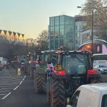 Tractors driving through busy London street during Budget Day protest