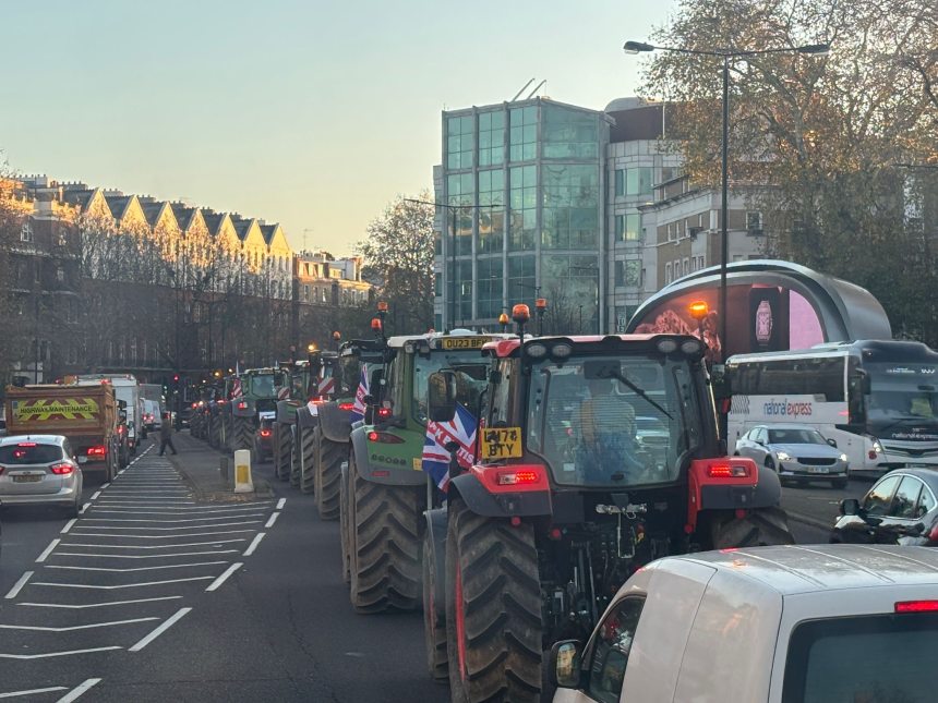 Tractors driving through busy London street during Budget Day protest