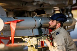 RAF armourers loading a Meteor missile onto a Typhoon FGR4 aircraft during Operation Shader.