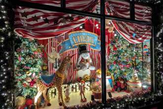 The 2024 Kindle House Christmas Window in Ystradgynlais, decorated with festive lights and displays, winner of Mary Portas’s Window of Wonder award.