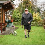 Malcolm Sims walking in his garden with his dog after joining the STEPS II Parkinson’s trial.