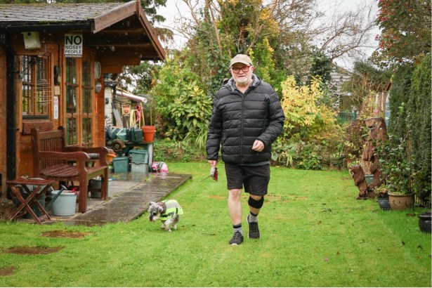 Malcolm Sims walking in his garden with his dog after joining the STEPS II Parkinson’s trial.