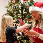 Geraldine Bradley, Carmarthenshire lottery winner, with Kiara, aged 3, wrapping toy gift boxes at ToyBox Project in Caerphilly.