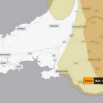 Met Office weather warning map highlighting yellow rain warnings in Swansea, Neath Port Talbot and Bridgend, and amber warnings in Newport and Monmouthshire.