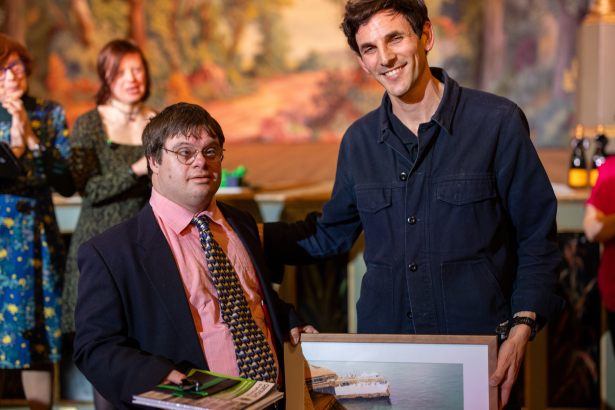 Stephen Lucas receiving prize from Rory Langdon‑Down.