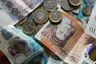 silver and gold coins on white printer paper