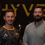 Ioan Jones and Greg George stand in front of HYVE branding after £500k gym acquisition in Carmarthenshire.