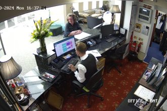 CCTV image from The Diplomat Hotel reception desk in Llanelli, showing guest involved in alleged unpaid bill incident.