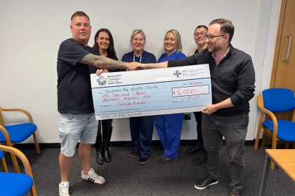 Carwyn Lewis presents £5,000 cheque to MS team at Morriston Hospital