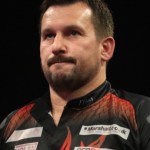 Jonny Clayton competing at the 2022 Cazoo Premier League Darts play‑off in Berlin, Germany.