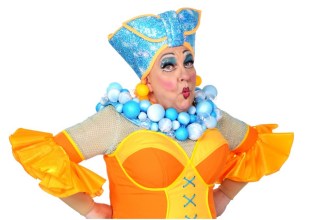 Kev Johns in full panto dame costume at Swansea Grand Theatre, celebrating nearly 30 years on stage.