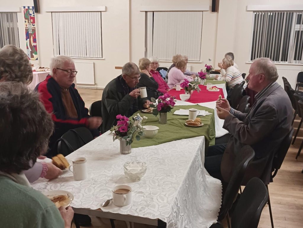 Supporters enjoying tea and cakes at Gellimanwydd Chapel to mark Rev Emyr Gwyn’s fundraising walk