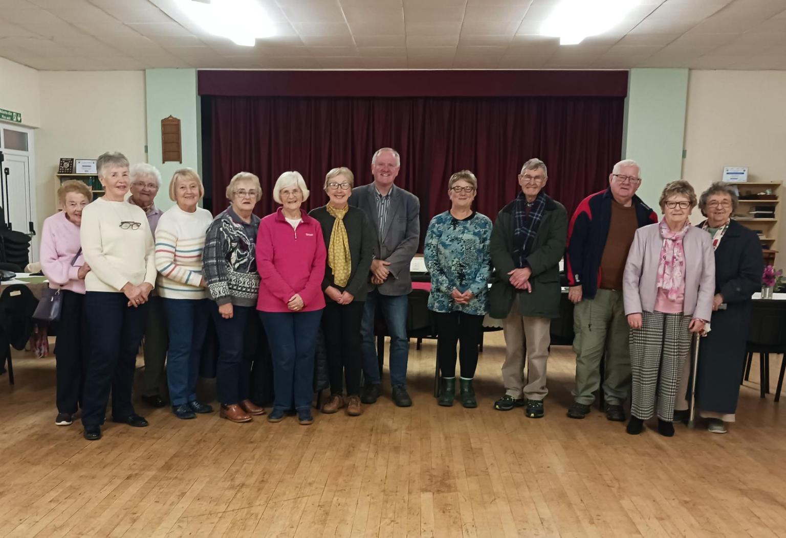 Rev Emyr Gwyn with supporters at Gellimanwydd Chapel after completing his 100‑mile charity walk