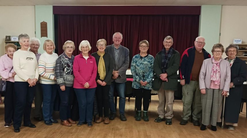 Rev Emyr Gwyn with supporters at Gellimanwydd Chapel after completing his 100‑mile charity walk