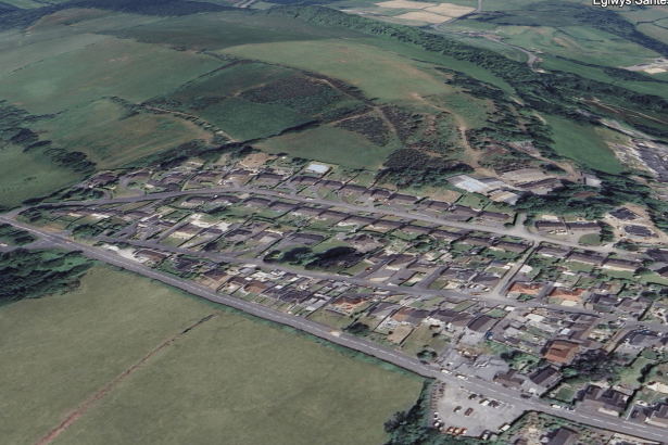 Satellite image of Fforest near Pontarddulais, showing houses, green fields, and land behind the village where a firearms incident was reported.