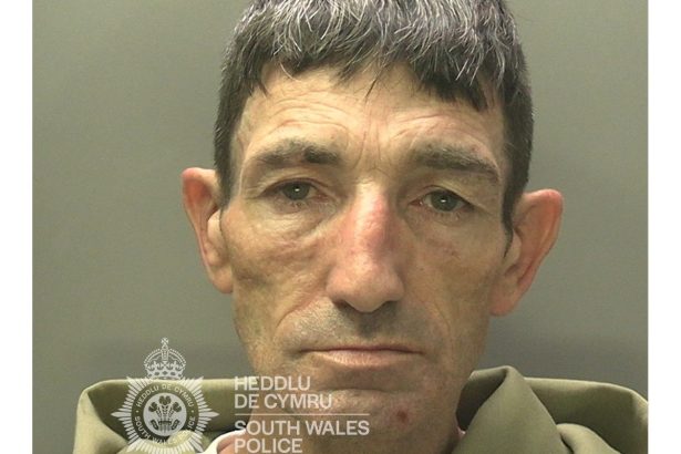 Police mugshot of Christopher Smith, 52, from Penlan, wearing a green hoodie.