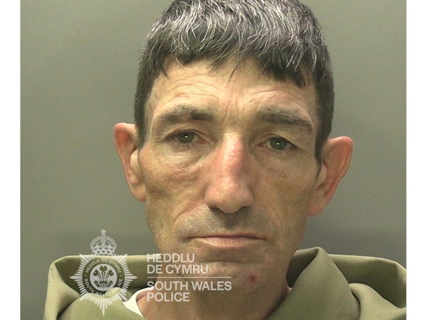 Police mugshot of Christopher Smith, 52, from Penlan, wearing a green hoodie.