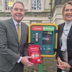 Rob Stewart and Melanie James standing beside a public bleed control kit in Swansea. Image credit: Swansea Council.