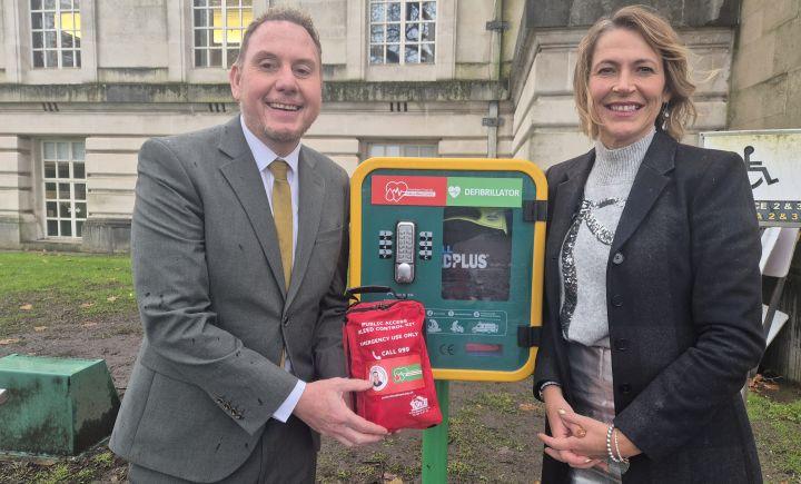 Rob Stewart and Melanie James standing beside a public bleed control kit in Swansea. Image credit: Swansea Council.