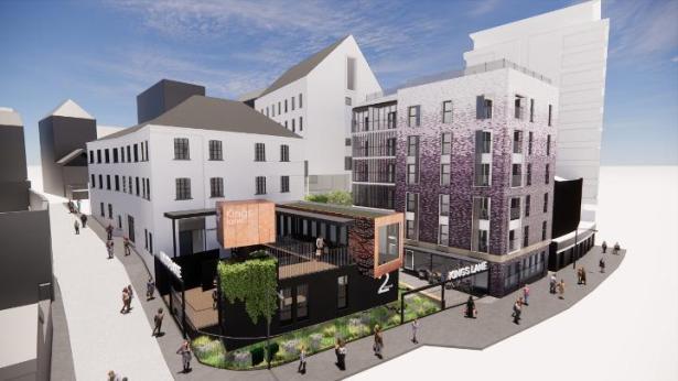Digital rendering of Swansea’s Kings Lane regeneration showing modern buildings, rooftop greenery, outdoor seating, and pedestrian pathways behind the Urban Village.
