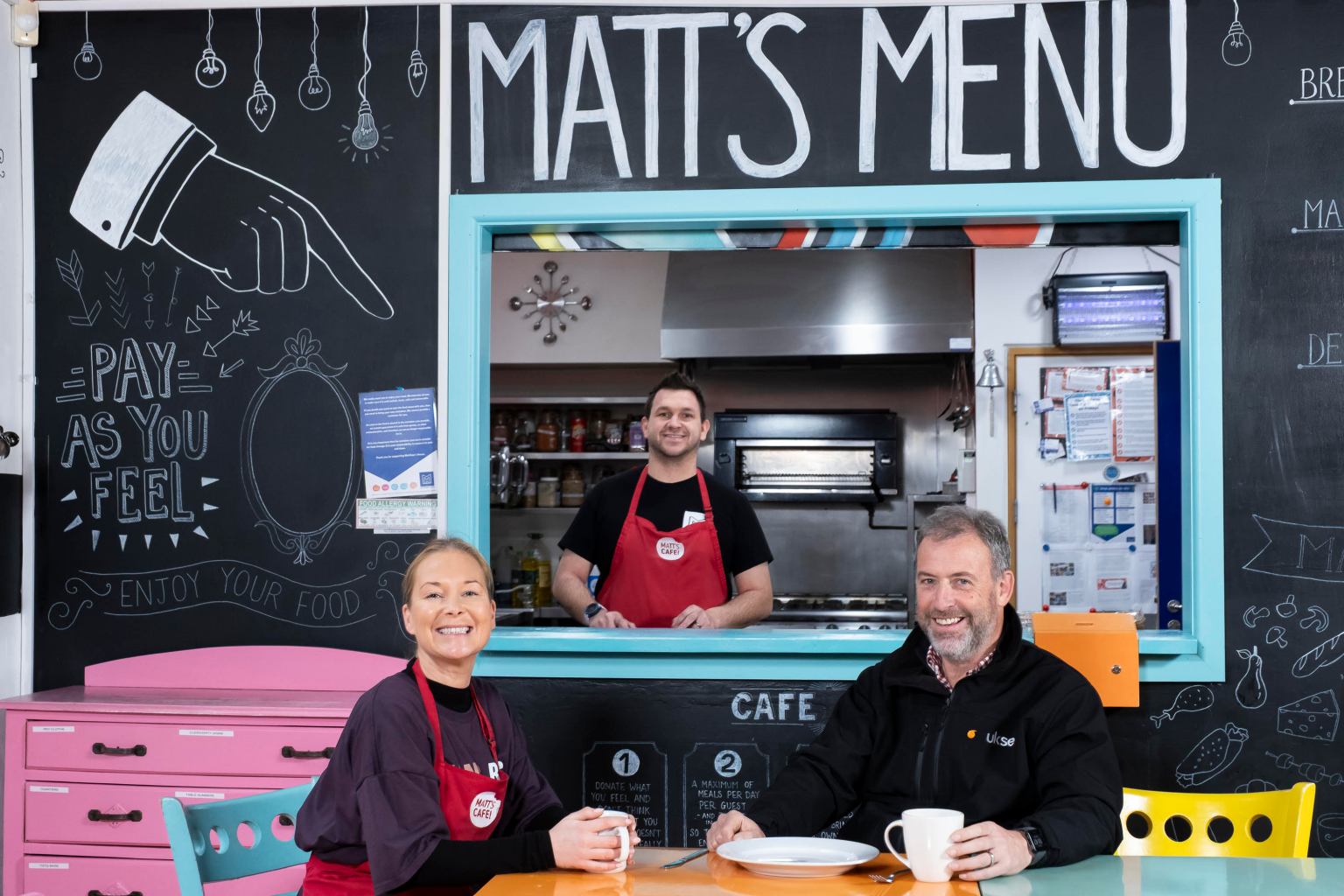 Becci Roberts and Tom Lynch of Matthew’s House with Alan Jenkins of UKSE inside Matt’s Café in Swansea.