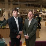 Steve Lemon and Rob Stewart stand inside Y Storfa with the new public library visible in the background.