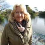 Fiona Hughes standing in Brynmill Park during her role as a Swansea Council Local Area Coordinator.