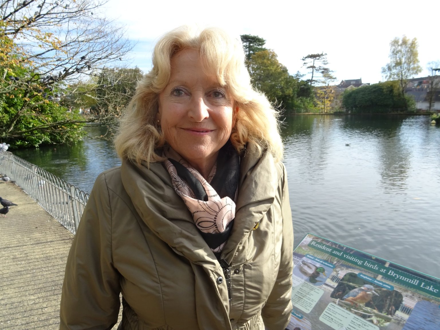Fiona Hughes standing in Brynmill Park during her role as a Swansea Council Local Area Coordinator.