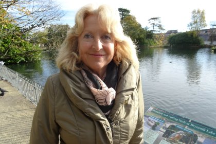 Fiona Hughes standing in Brynmill Park during her role as a Swansea Council Local Area Coordinator.