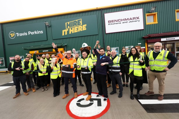 Staff standing outside the new Travis Perkins branch in Llansamlet after its relocation from Cwmdu.
