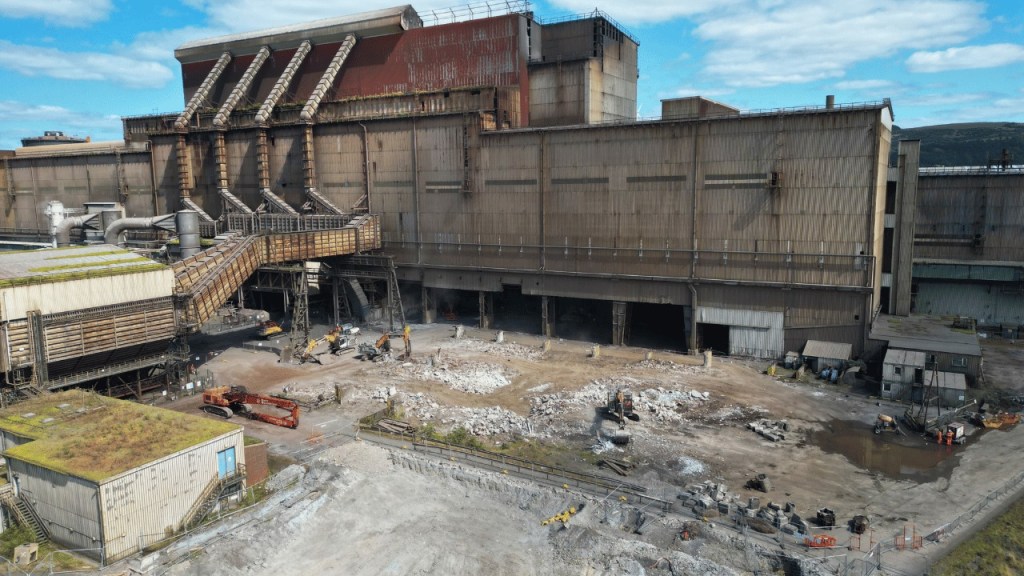 Industrial demolition site at Port Talbot steelworks with excavators and cleared rubble. (Tata Steel)