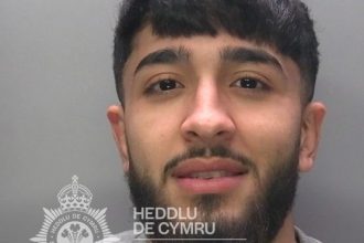 Police mugshot of Abbas Al‑Sulaimawi, the 22‑year‑old Swansea man jailed for running the “Milly” drugs line supplying crack cocaine and heroin.