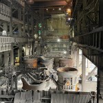 Interior of Port Talbot steelworks showing ladles, cranes and heavy metal infrastructure. (Tata Steel)