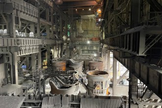 Interior of Port Talbot steelworks showing ladles, cranes and heavy metal infrastructure. (Tata Steel)