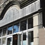 Close‑up view of the stone exterior of Maesteg Community Hospital, showing its historic architectural façade.
