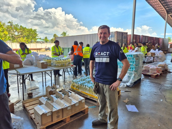 Nigel Jones wearing REACT gear while carrying out humanitarian response work as part of the rapid deployment team.