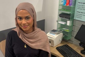 Khadija Ali, a weekend optical assistant at Specsavers Swansea, pictured in store. (Specsavers)