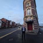 Torsten Bell MP standing in front of the Palace Theatre in Swansea.