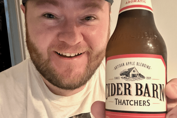 Scott Sullivan holding a bottle of Thatchers Redwood following the cider’s return.