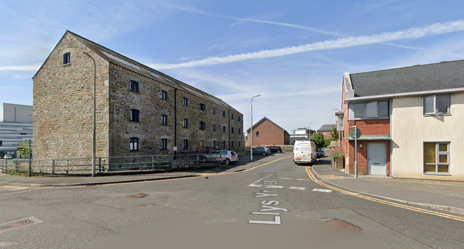 Rear view of the redeveloped Buckley’s Brewery site in Llanelli, with the renovated maltings alongside newly built townhouses created through the Pen y Porth project.
