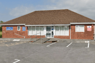 Street‑view image showing the front entrance of Meddygfa’r Sarn GP surgery in Pontyates.