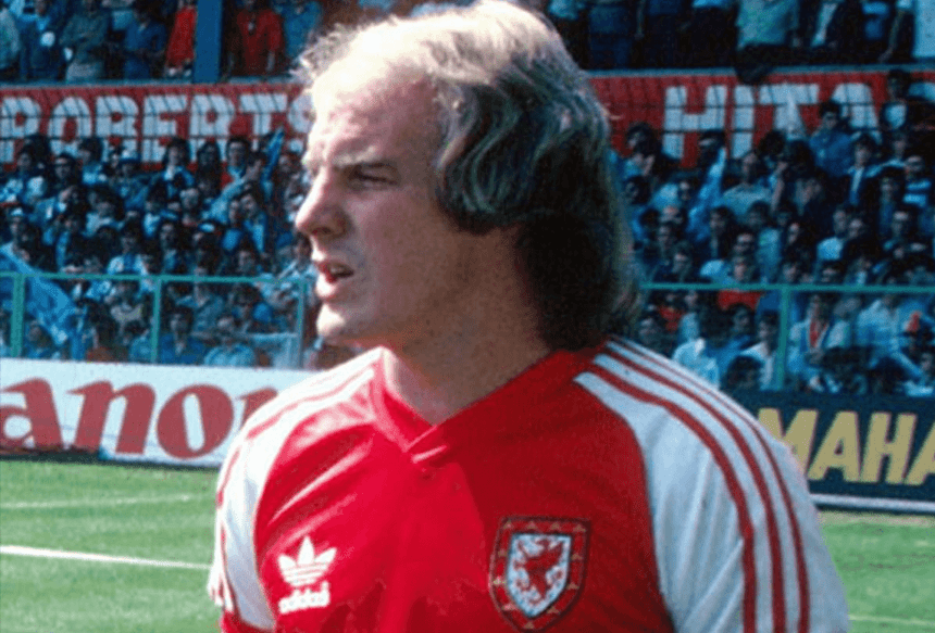 Terry Yorath standing pitchside in FAW training gear during his time with the Wales national team.
