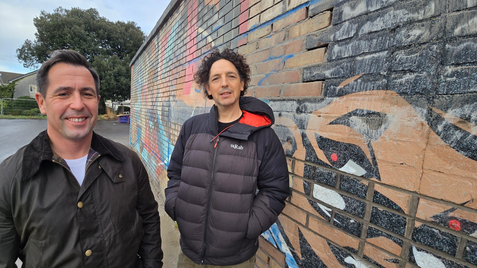 Cllr Andrew Stevens and Jeremy Donaldson standing on site at Victoria Park during the start of construction on the new skate plaza.